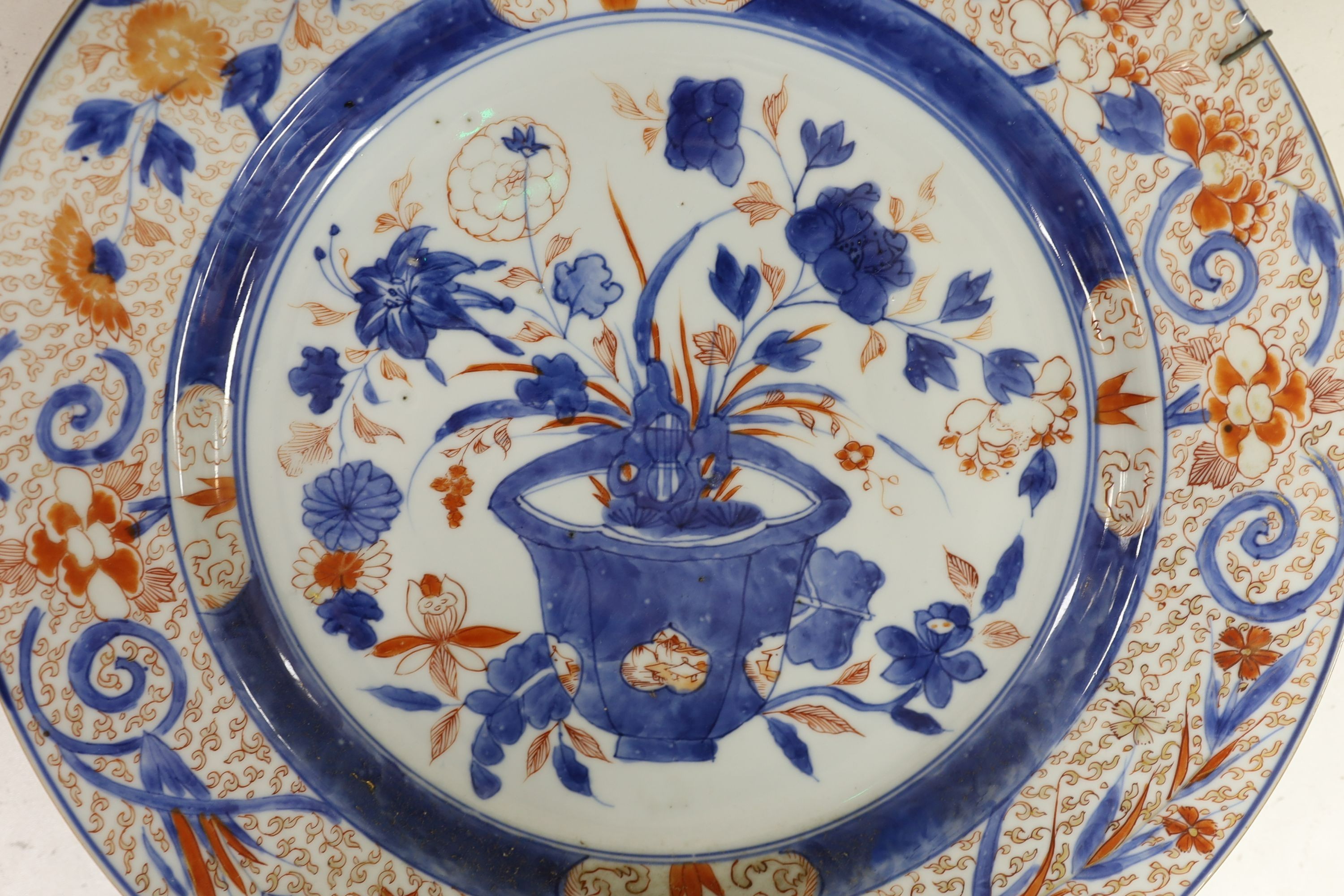 A pair of Chinese Imari dishes, Kangxi period, on wooden stands, 31 cms diameter., Provenance - D.C.Monk & Son, former dealers based in Kensington Church Street, London W8